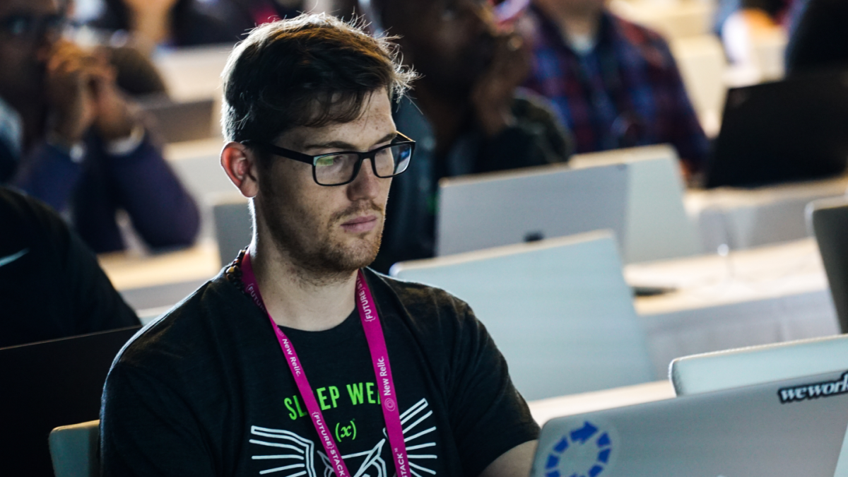 FutureStack 22 audience member taking notes on laptop