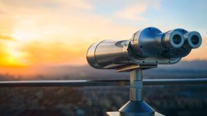 binoculars looking out over a city