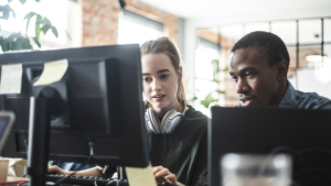 Two developers looking at a computer