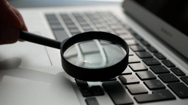 Computer keyboard with magnifying glass