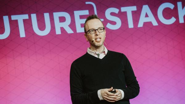 A man giving a talk at Futurestack