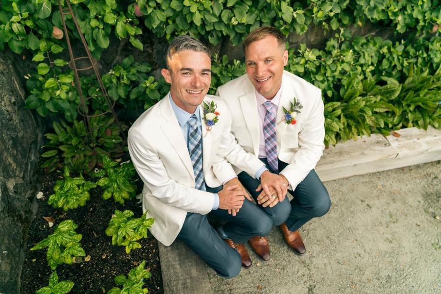 Greg with his husband on wedding day