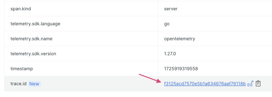 Screen shot of the attributes list for the GetProducts error group, with an arrow pointing to the value for "trace.id", which is a clickable link to an associated trace.